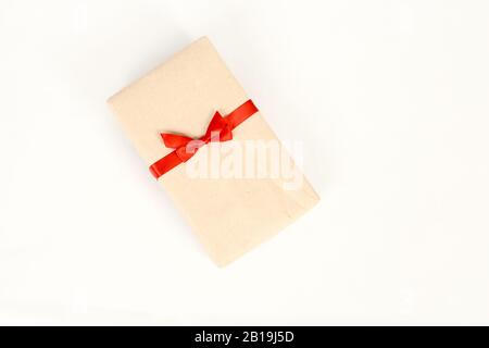 Gift wrapped in kraft paper Stock Photo