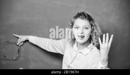 Informing kids. School rules. School principal stressful outraged expression. Educational system concept. School lesson knowledge. Remember this. Strict woman teacher pointing at chalkboard. Stock Photo