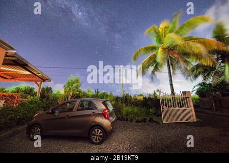 Parked car in a beautiful park under the milky way. Stock Photo