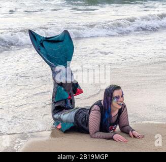 Woman cosplay costume dressed as a mermaid posing on the sand at Bathers Beach Fremantle Western Australia. Stock Photo