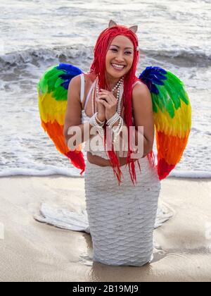 Woman cosplay costume dressed as a mermaid posing on the sand at Bathers Beach Fremantle Western Australia. Stock Photo