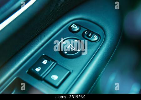 Close-up to mirror adjustent panel in car Stock Photo