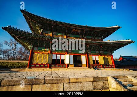 Seoul, South Korea - FEB 23 2020: Usually a busy weekend location, two visitors enjoy an empty Changdeokgung palace during the COVID19 pandemic. Stock Photo
