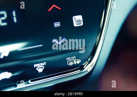 Automatic air conditioning touch panel and close-up to glass and mirrors heating button Stock Photo