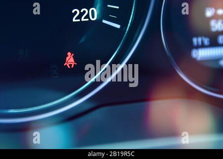 Safety belts warning control at car dashboard Stock Photo