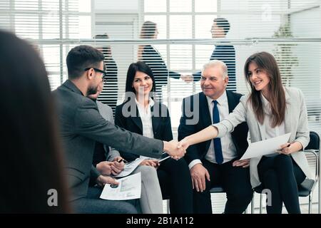 business colleagues shaking hands with each other. Stock Photo