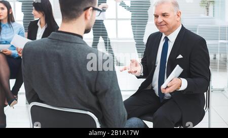 business man explaining something to his colleague. Stock Photo