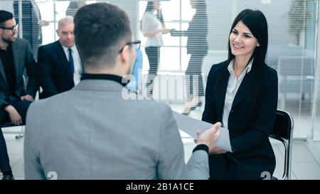 business woman discussing something with a colleague before a business meeting Stock Photo