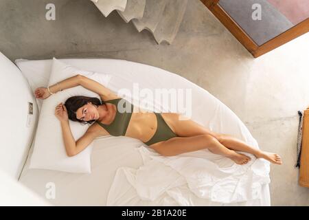 Attractive young female relaxing in the daytime Stock Photo