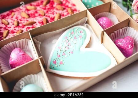 Gift set with hand made sweets in a box on a white table. Stock Photo