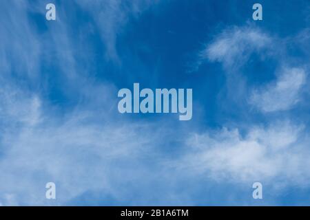 Spindrift beautiful white clouds in blue sky background Stock Photo