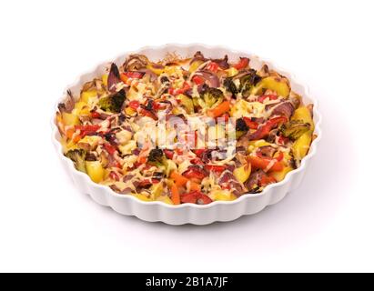 Mixed roasted vegetables on baking dish isolated on white Stock Photo