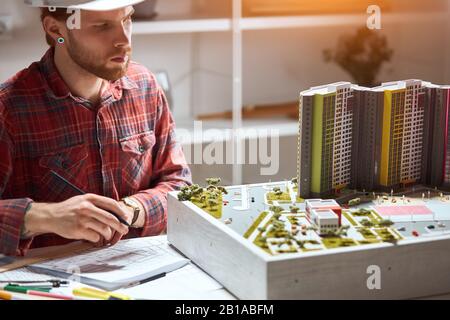 talented architects making notes on the blueprint, close up photo Stock Photo
