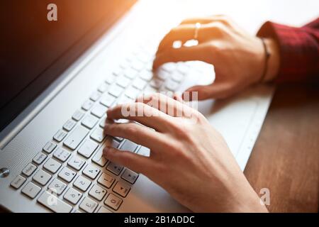 young programmer working with computer in the office, close up photo. working hours, man preparing a report, project. lifestyle, interets, free time Stock Photo