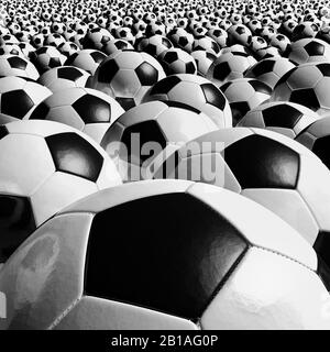 Football balls close up. Traditional retro Black and White, Clean and new. Stock Photo