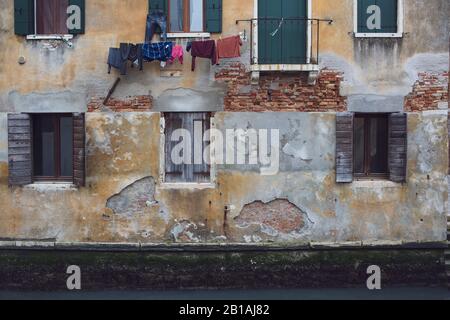 Washing hanging out to dry from a building in Venice, Italy Stock Photo