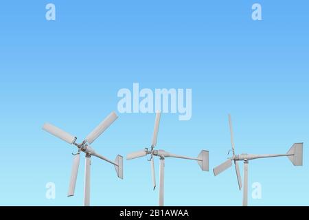 Eco friendly wind turbine looking up from below isolated on white background for Earth Day environmental concept. Stock Photo