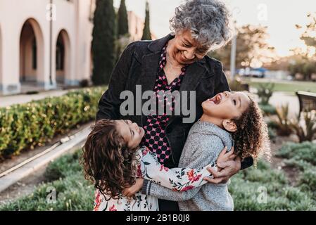 Close up lifestyle image of grandmother and grandchildren laughing Stock Photo