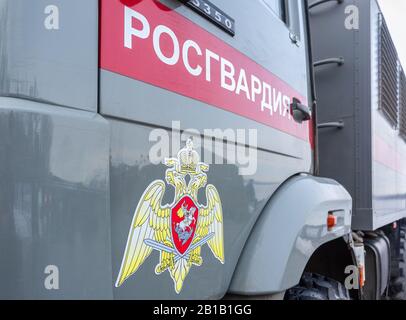 Samara, Russia - February 23, 2020: Inscription 'Rosgvardia' and emblem of the troops of the National Guard of the Russian Federation on the board of Stock Photo