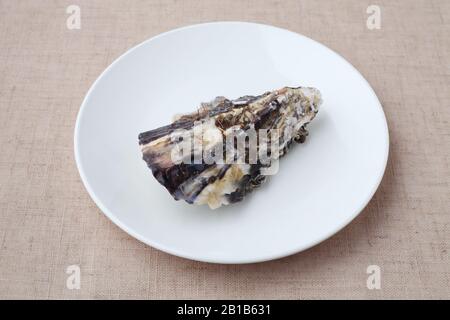 boiled oyster on plate closeup isolated on table cloth Stock Photo