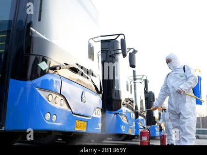 Hohhot City, China. 24th Feb 2020. Chinese workers disinfect buses to be put into operation for prevention of the novel coronavirus and pneumonia at a bus terminal and maintenance station in Hohhot City, north Chinas Inner Mongolia Autonomous Region on February 24th, 2020. (Photo by Wang Zheng / Costfoto/Sipa USA) Credit: Sipa USA/Alamy Live News Stock Photo