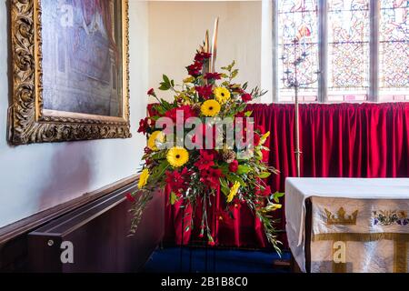 Christmas flower display at All Saints Church in East Budleigh. Stock Photo