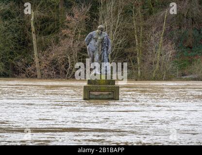 Shrewsbury, UK. 24th Feb, 2020. Statue of Hercules in the Quarry surrounded by flood water from the River Severn. Credit: Mike Hayward/Alamy Live News Stock Photo