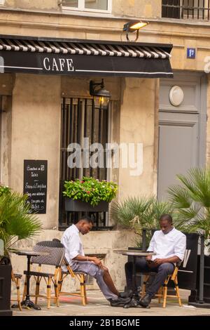 restaurant workers taking a break in Paris France Stock Photo