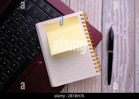 top view of notepad, pen and laptop on desk  Stock Photo