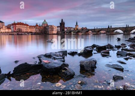 Charles Bridge in Prague at sunset Stock Photo