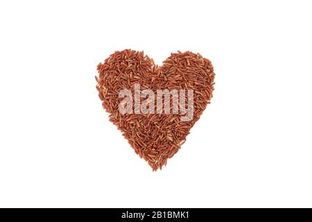Heart made of rice isolated on white background Stock Photo