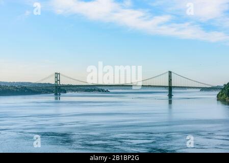 The Tacoma Narrows bridge is actually two suspension bridges over Puget Sound, serving as a link between Tacoma & the Kitsap Peninsula. Stock Photo