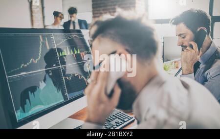 Business team investment trading do this deal on a stock exchange. People working in the office. Stock Photo