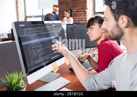 Developing programming and coding technologies. Website design. Programmer working in a software develop company office. Stock Photo