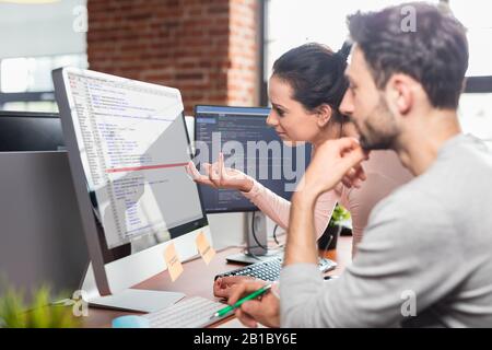 Developing programming and coding technologies. Website design. Programmer working in a software develop company office. Stock Photo