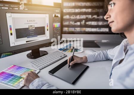 Graphic designer at work. Color swatch samples. Stock Photo