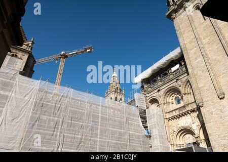 Scaffold covered with a white canvas for protection on Santiago de Compostela Cathedral. Restoration of historical buildings concept Stock Photo