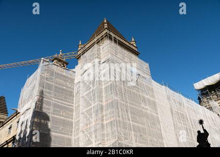 Scaffold covered with a white canvas for protection on Santiago de Compostela Cathedral. Restoration of historical buildings concept Stock Photo