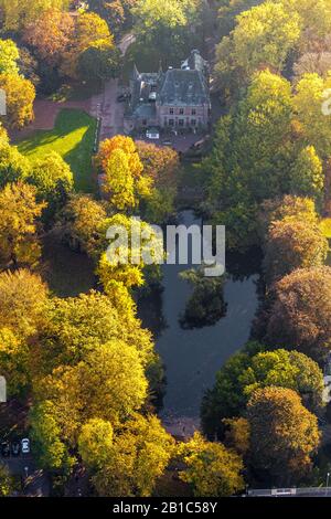 Aerial photograph, Restaurant Castle Ingenhoven in the autumnal forest, Lobberich district, Ingenhovenpark, Nettetal, Lower Rhine, North Rhine-Westpha Stock Photo