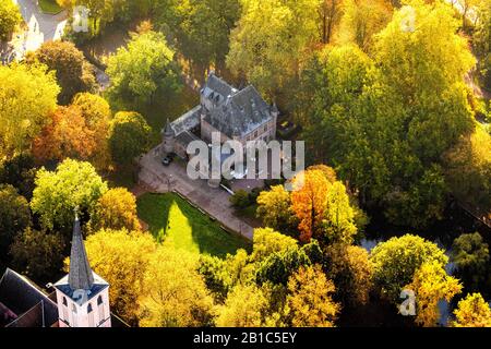 Aerial photograph, Restaurant Burg Ingenhoven in the autumnal forest, Lobberich district, Ingenhovenpark, Nettetal, Lower Rhine, North Rhine-Westphali Stock Photo