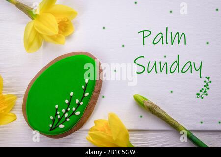 Sweet gingerbread and spring daffodils flowers. Holiday card. Religion holiday palm sunday Stock Photo