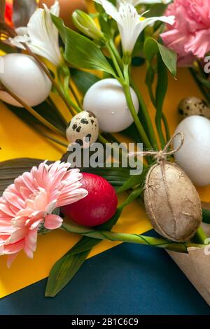A big spring bouquet made with bright flowers and decorated easter eggs. View from above. Top view. Happy Easter concept Stock Photo