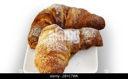 freshly baked croissants on white plate Stock Photo