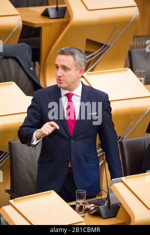 Edinburgh, UK. 20 February 2020.   Pictured: Alex Cole-Hamilton MSP - Spokesperson for health and MSP for Edinburgh Western for thee Scottish Liberal Democrat Party.  Scenes from inside the debating chamber of the Scottish Parliament in Holyrood, Edinburgh. Stock Photo