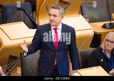 Edinburgh, UK. 20 February 2020.   Pictured: Alex Cole-Hamilton MSP - Spokesperson for health and MSP for Edinburgh Western for thee Scottish Liberal Democrat Party.  Scenes from inside the debating chamber of the Scottish Parliament in Holyrood, Edinburgh. Stock Photo