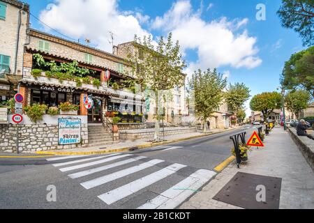 A French bistro cafe sits on a street just outside the medieval village of Tourrettes Sur Loup in France. Stock Photo