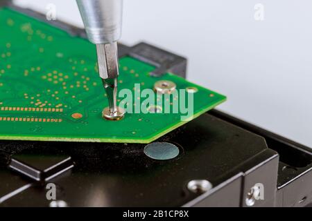 Part of computer in disassembled hard drive from the computer Stock Photo
