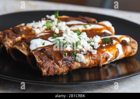 Enfrijoladas, Vegetarian Mexican Cuisine, Typical Antojitos Easy Meals Stock Photo