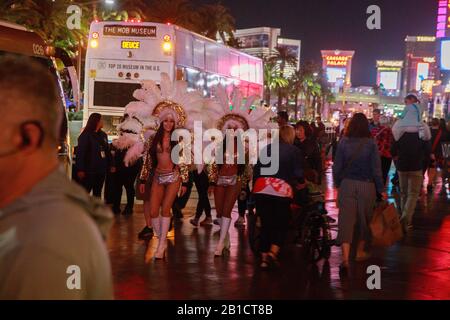 02192020 - Las Vegas, Nevada, USA: Showgirls walk along Las Vegas Ave outside the Paris Theater during the Democratic Nevada Debate in Las Vegas, Nevada, Wednesday, Feb. 19, 2020. Stock Photo
