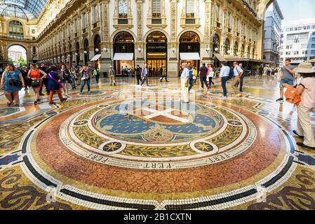 Milan, Italy - May 16, 2017: Tourists are walking in the Galleria Vittorio Emanuele II on the Piazza del Duomo in central Milan. This gallery is one o Stock Photo